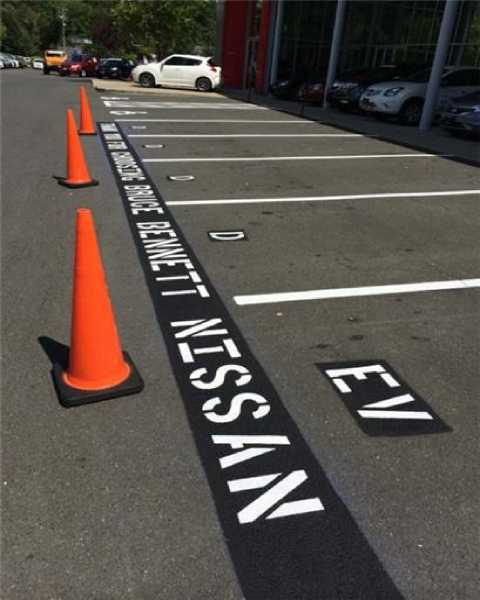 We Do Lines - A parking lot with orange cones.