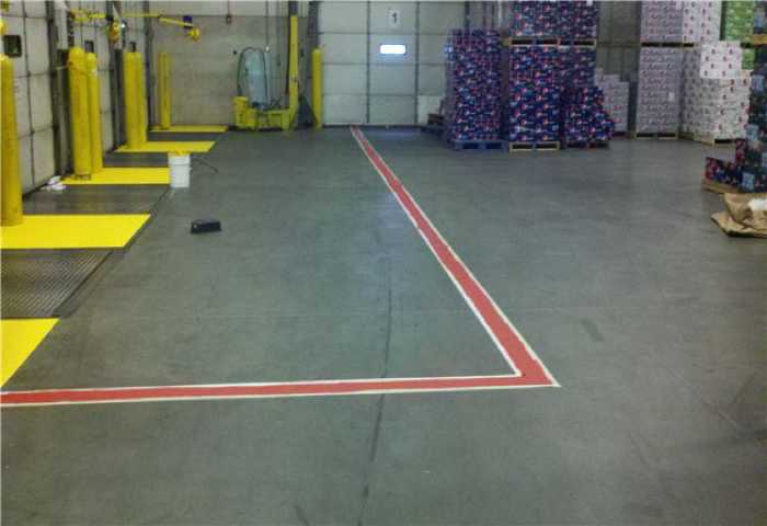 We Do Lines - A warehouse with a red line.