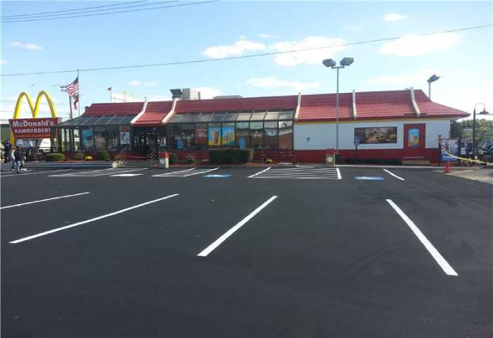 We Do Lines - A mcdonald's restaurant with a parking lot.