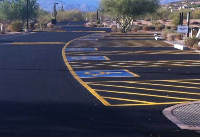 We Do Lines - A parking lot with yellow and blue stripes.