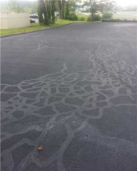 We Do Lines - An image of a parking lot with a pattern on it.