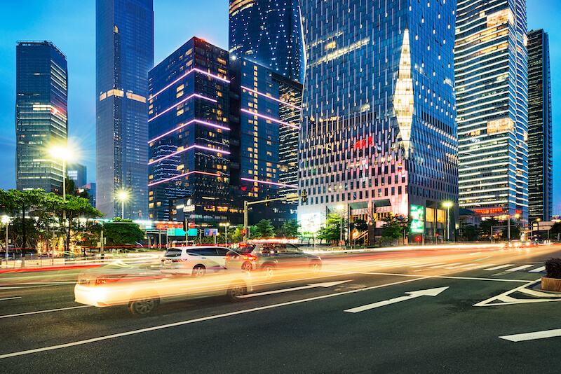 We Do Lines - A city street with buildings in the background.