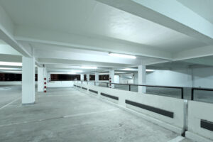 We Do Lines - An empty parking garage at night.