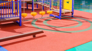 We Do Lines - A playground with a slide and swings.