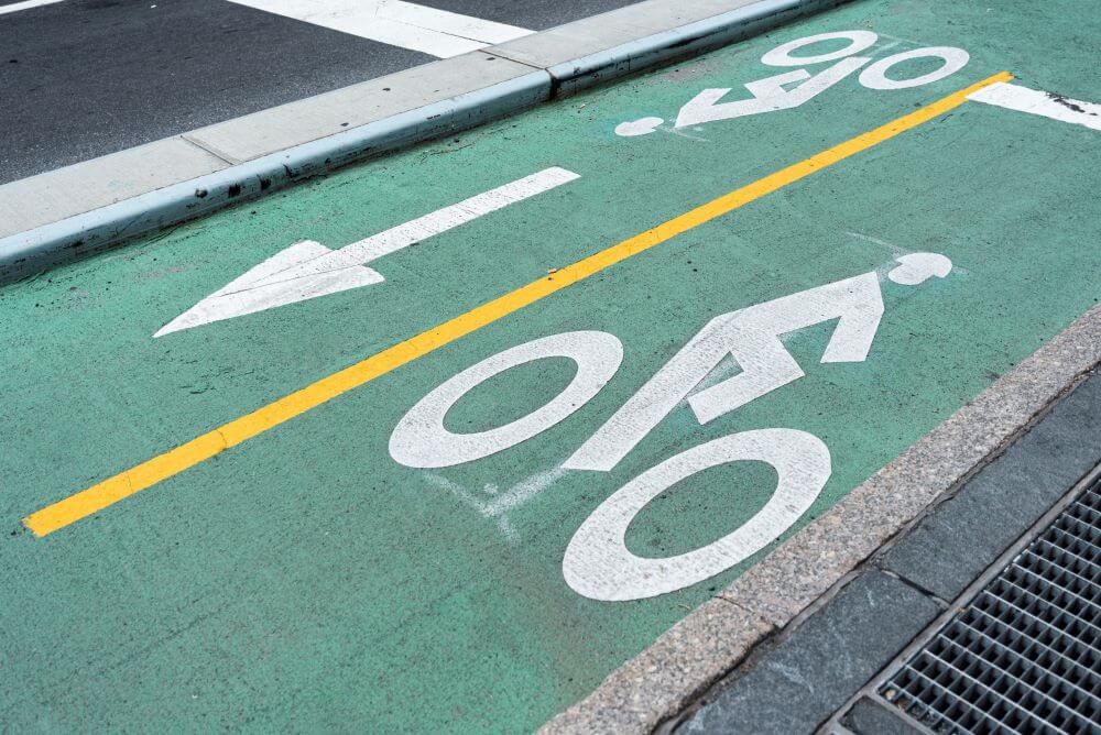 Photo of a green bicycle lane on a road